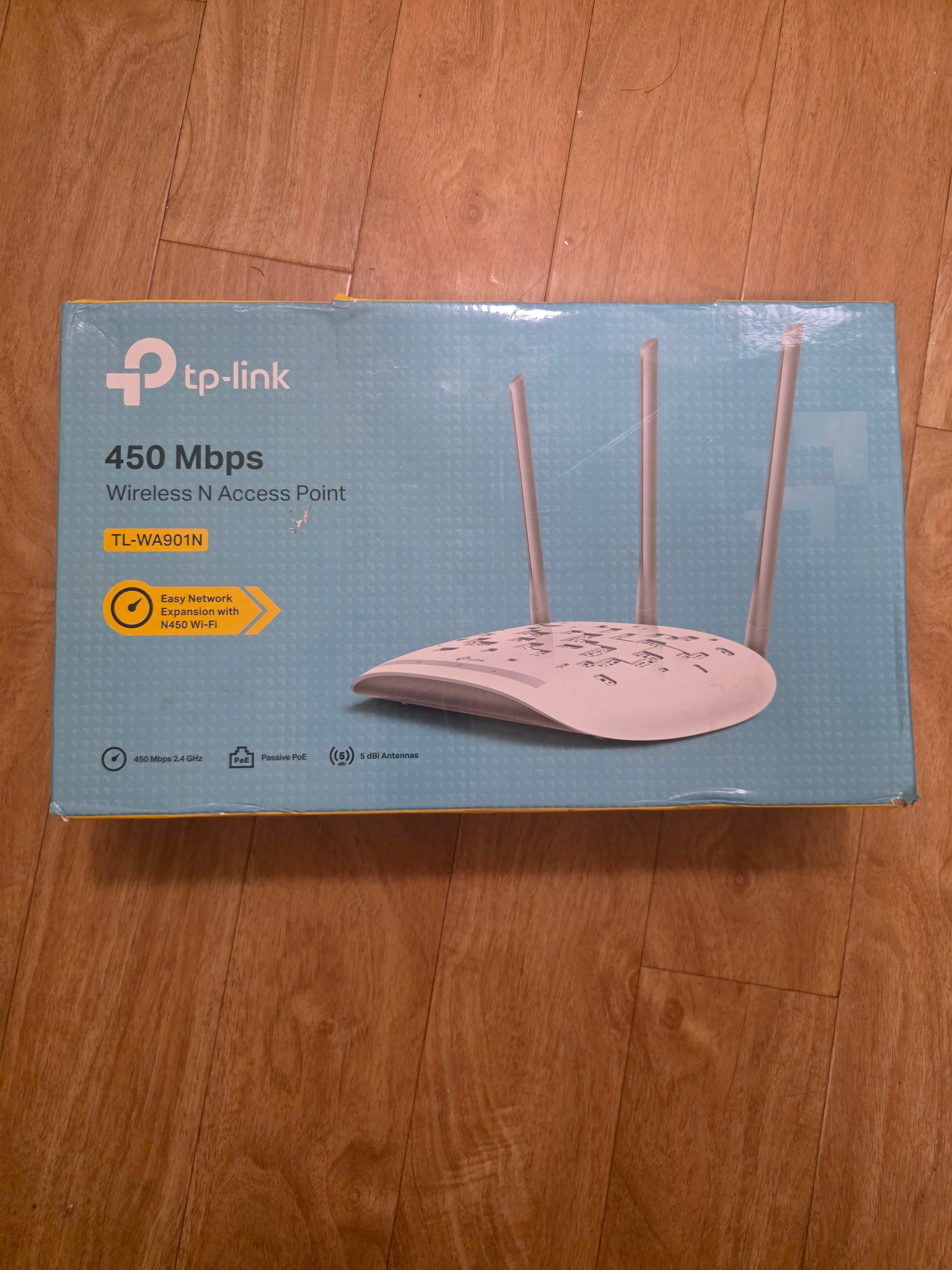 TP-Link wireless router packaging on a wooden floortoaashop.com,toaa,thriftonline, thrift online, second hand, used stuff,
