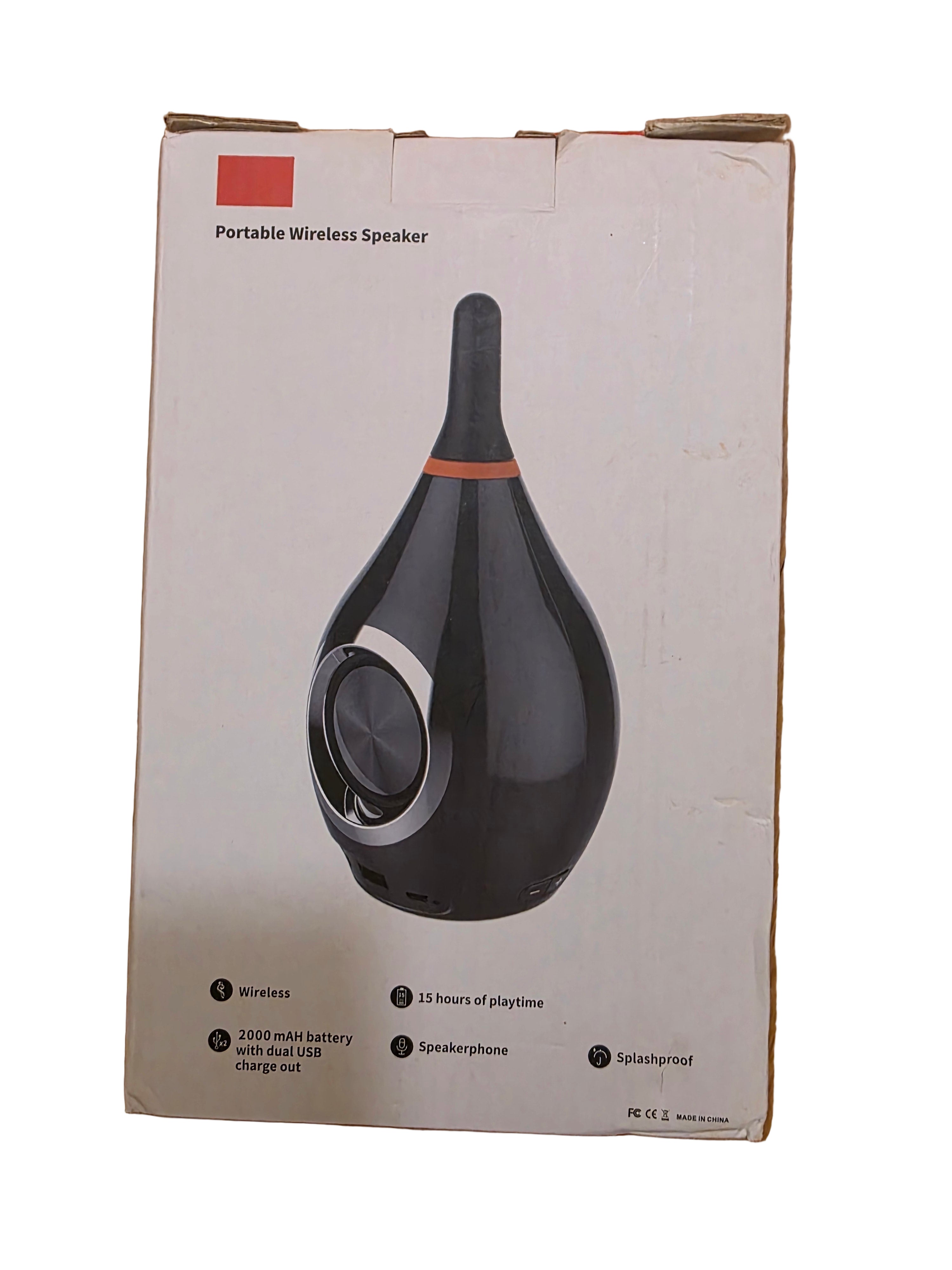 Box with a portable wireless speaker design on a wooden floortoaashop.com,toaa,thriftonline, thrift online, second hand, used stuff,