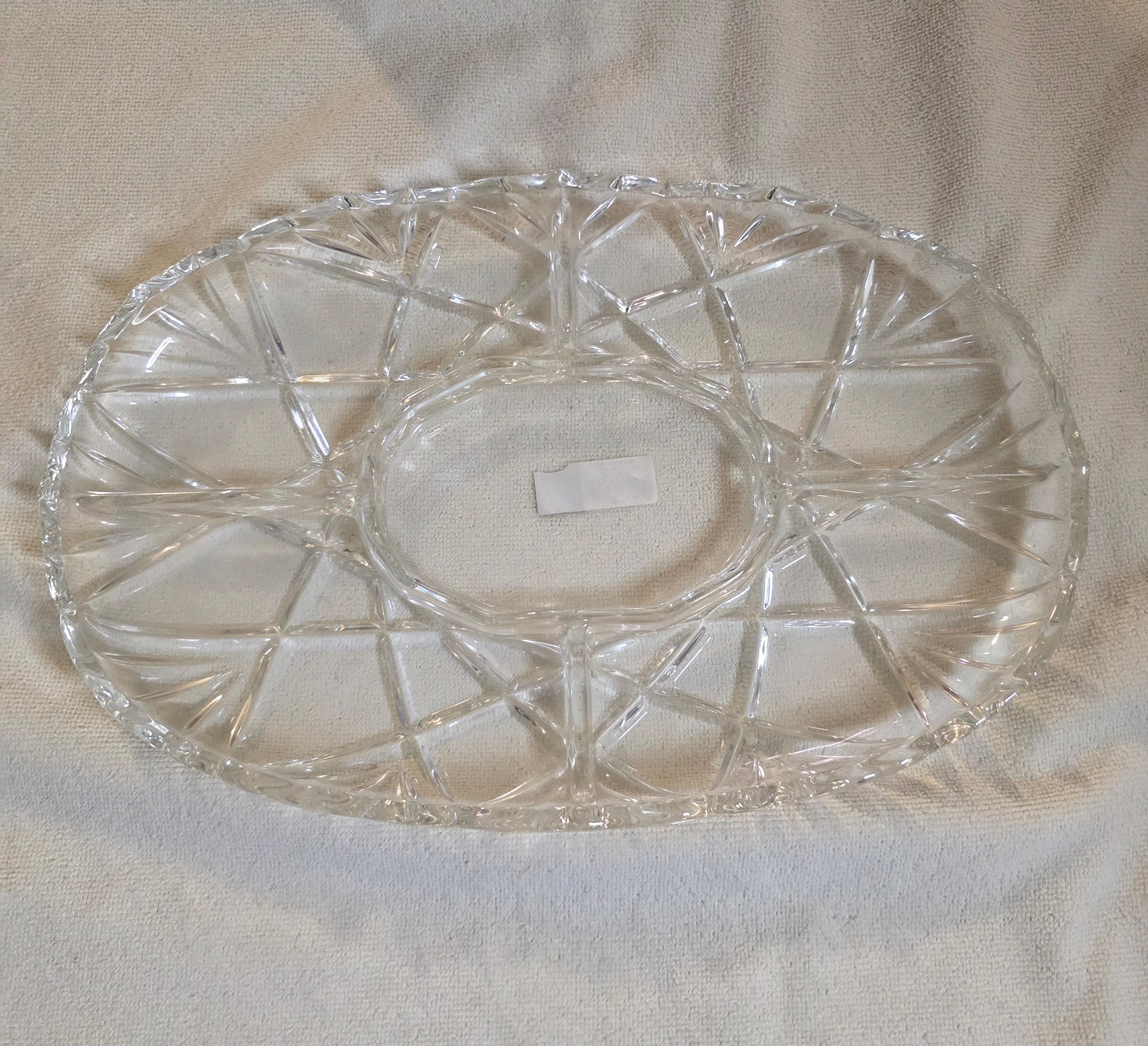 Clear glass dish with intricate design on a white surface thrift online, Acv2, TOAA shop, Toaa, TOA, toaaa shop, Silvio, jaiba, second hand, used stuff