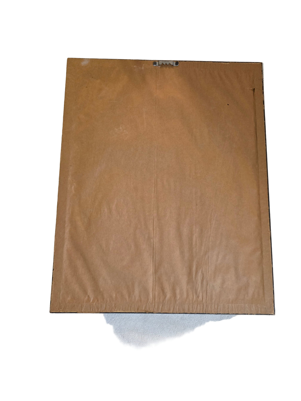 Brown cardboard sheet on a white fabric backgroundtoaashop.com,toaa,thriftonline, thrift online, second hand, used stuff,