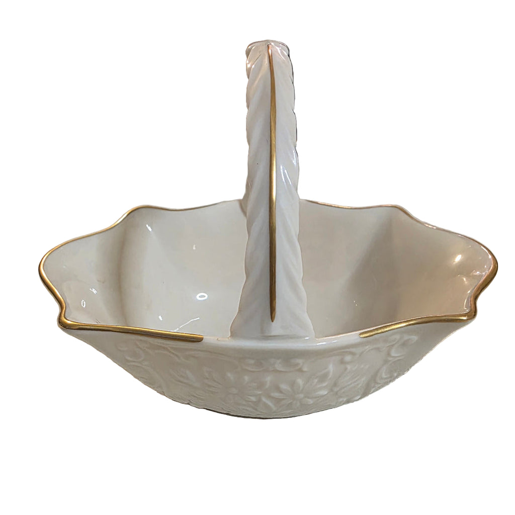 White ceramic bowl with gold rim on a textured surface, toaashop.com