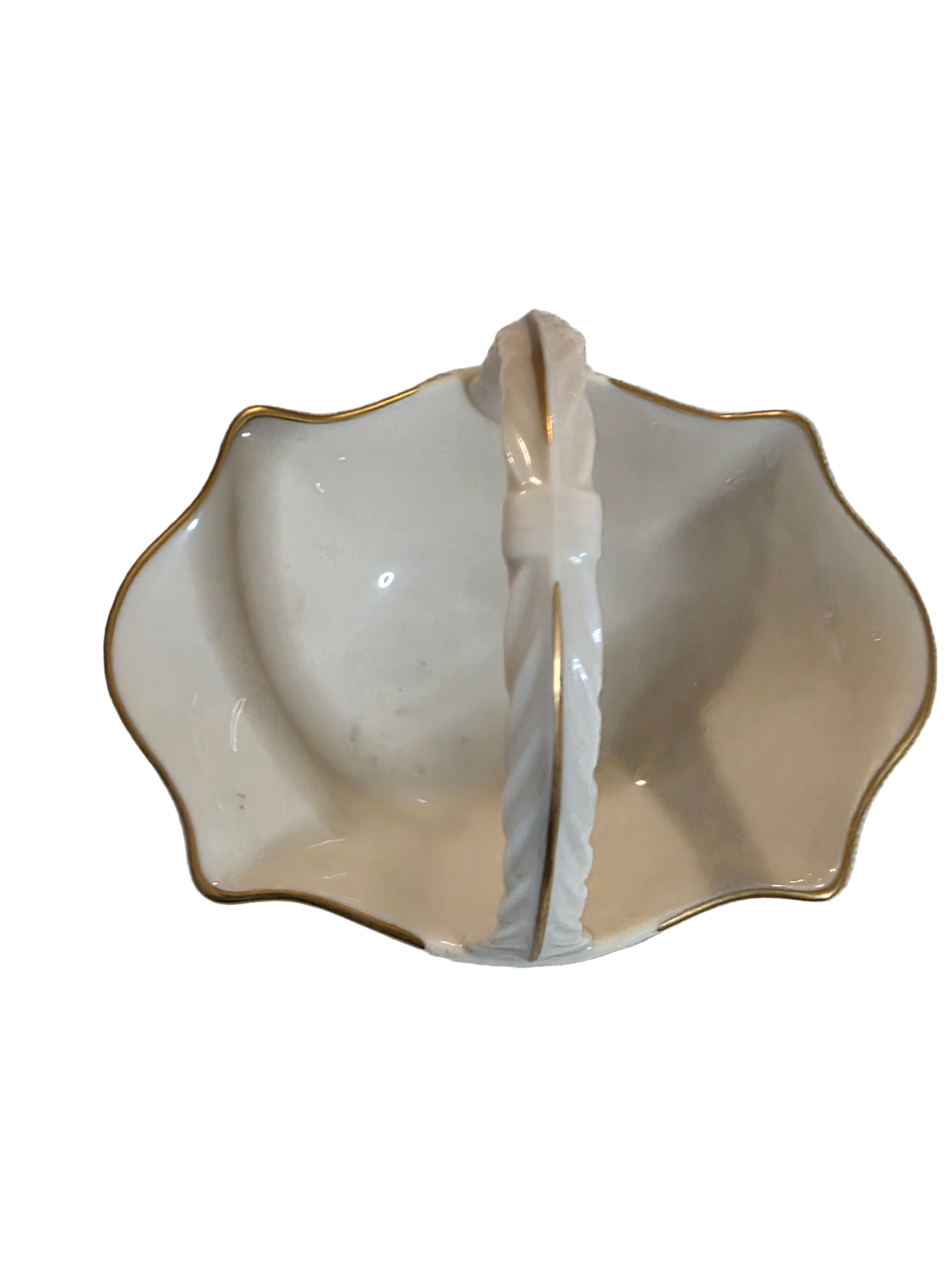 White ceramic dish with gold rim on a textured beige backgroundToaashop,toaa,thriftonline