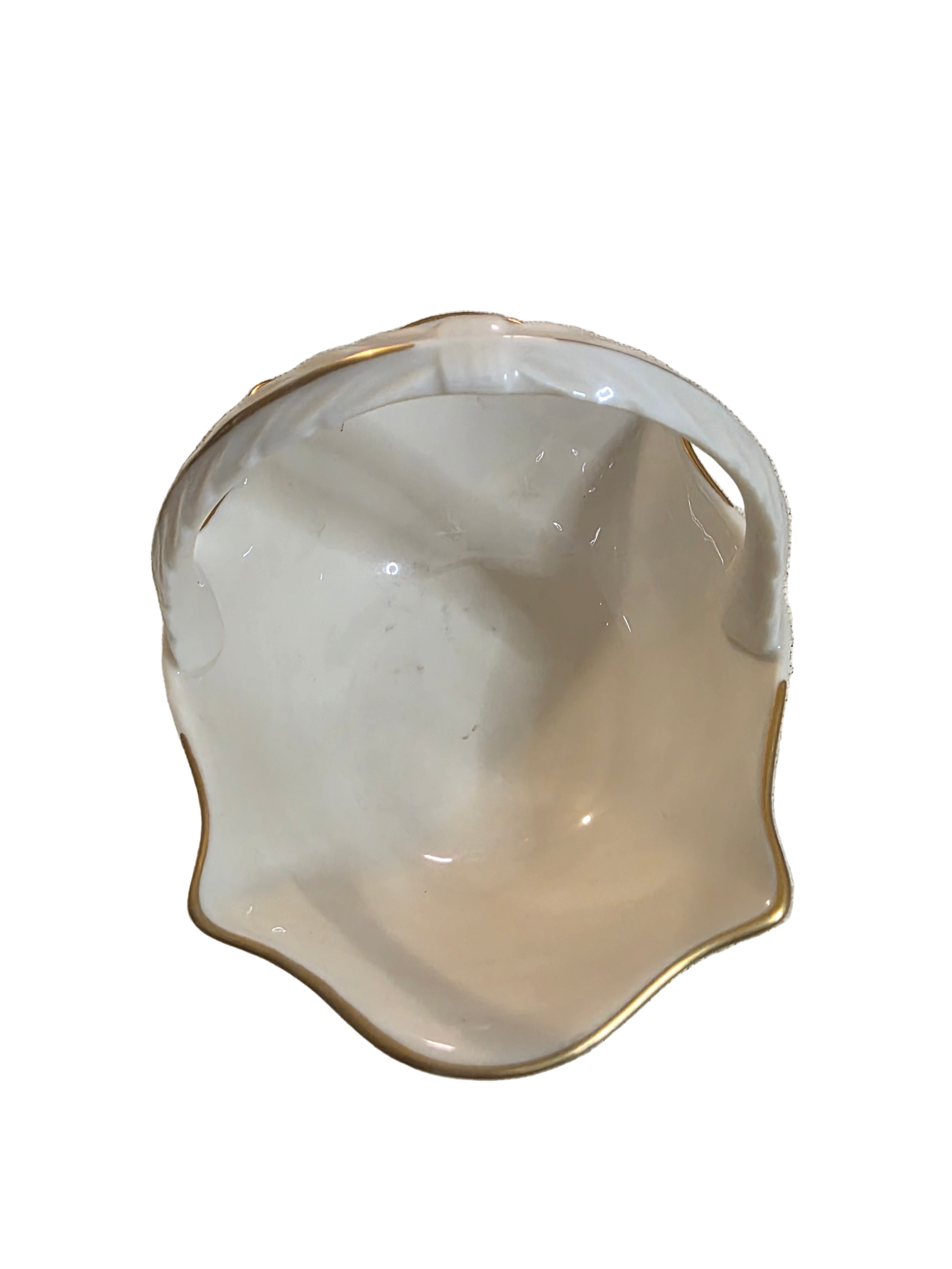 Shell-shaped ceramic bowl on a textured surface, Toaashop,toaa,thriftonline
