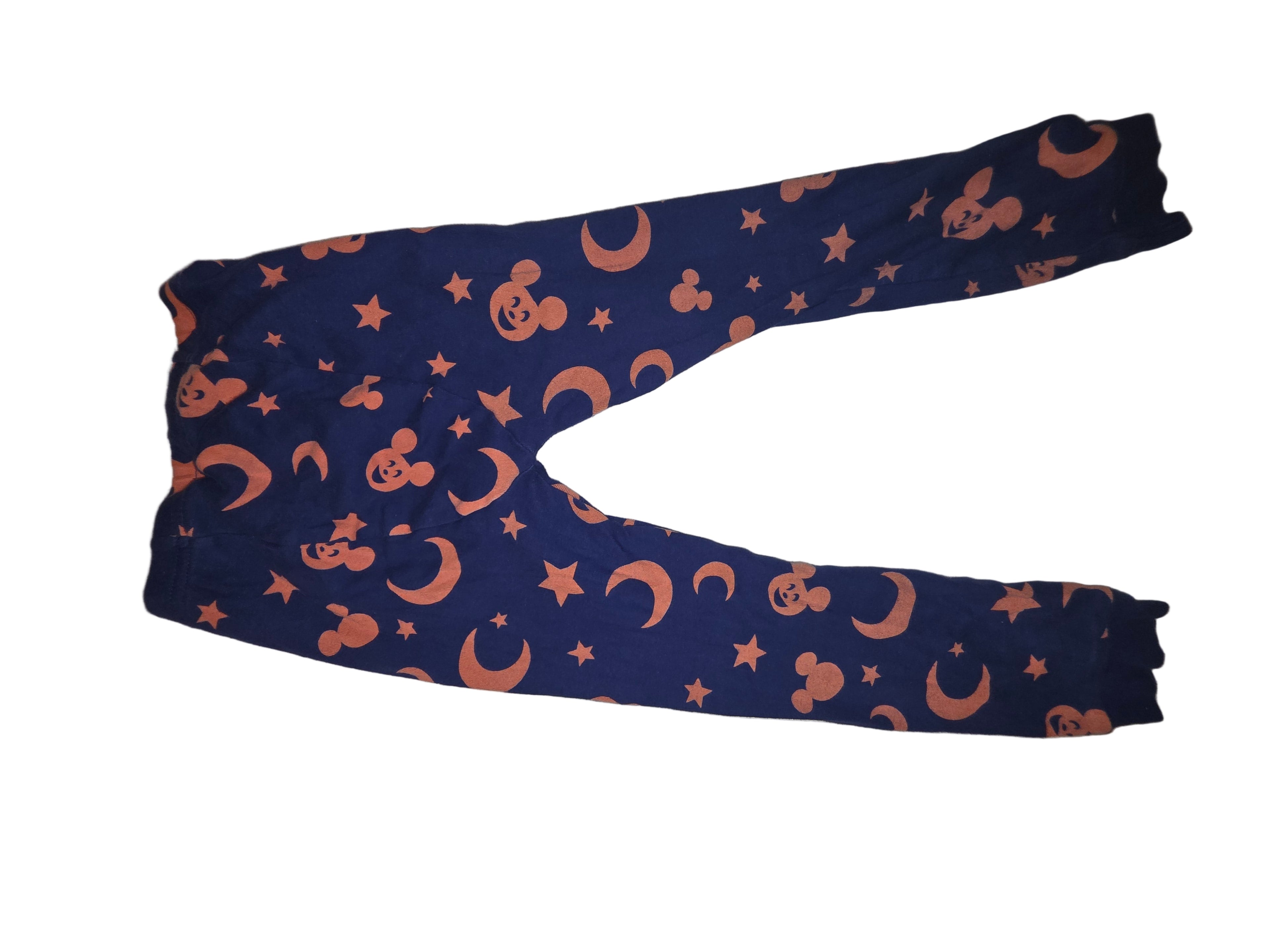 Blue leggings with pink Mickey Mouse and star pattern on a beige surface toaa