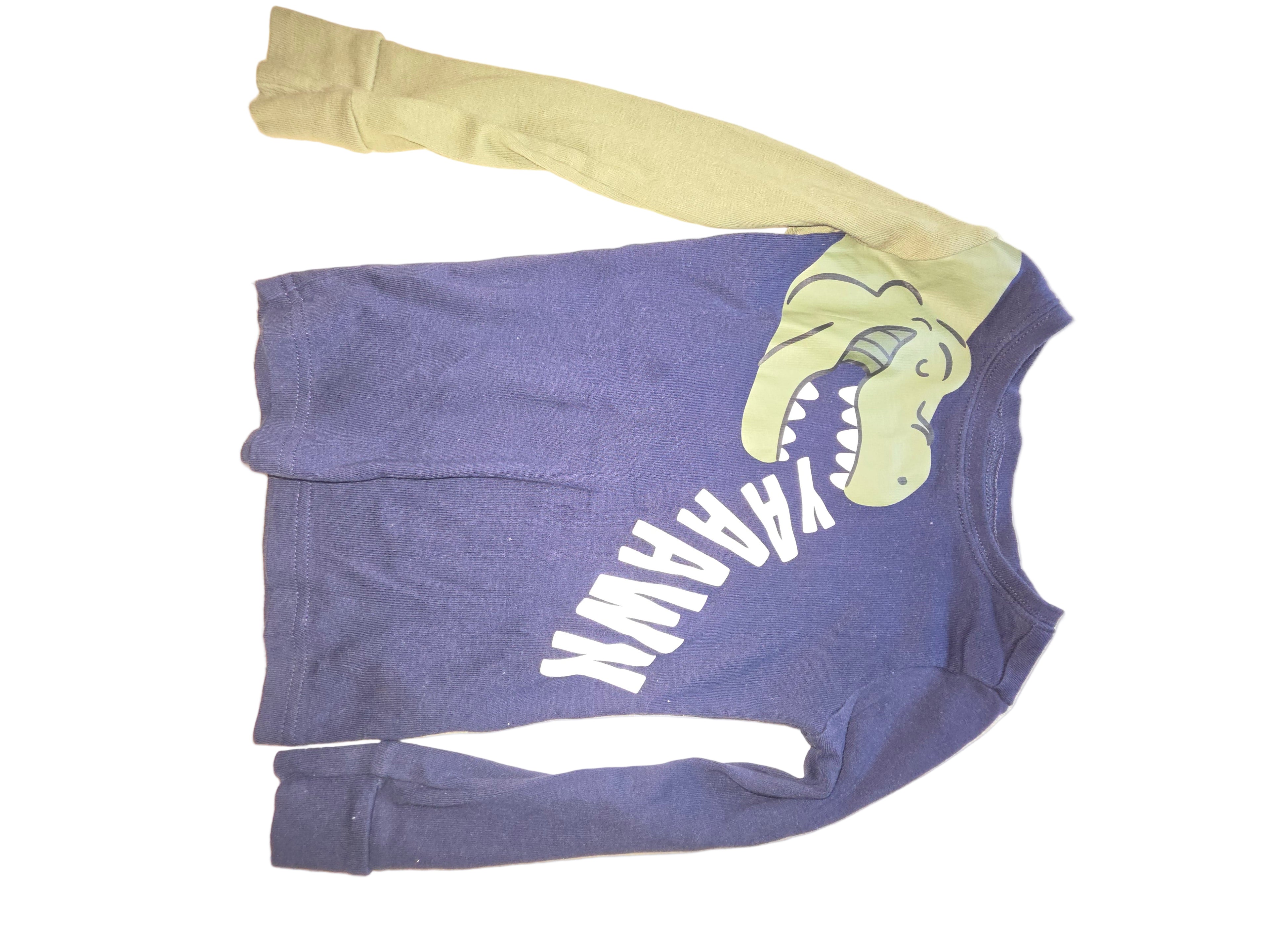 Purple shirt with a graphic design on a white surface