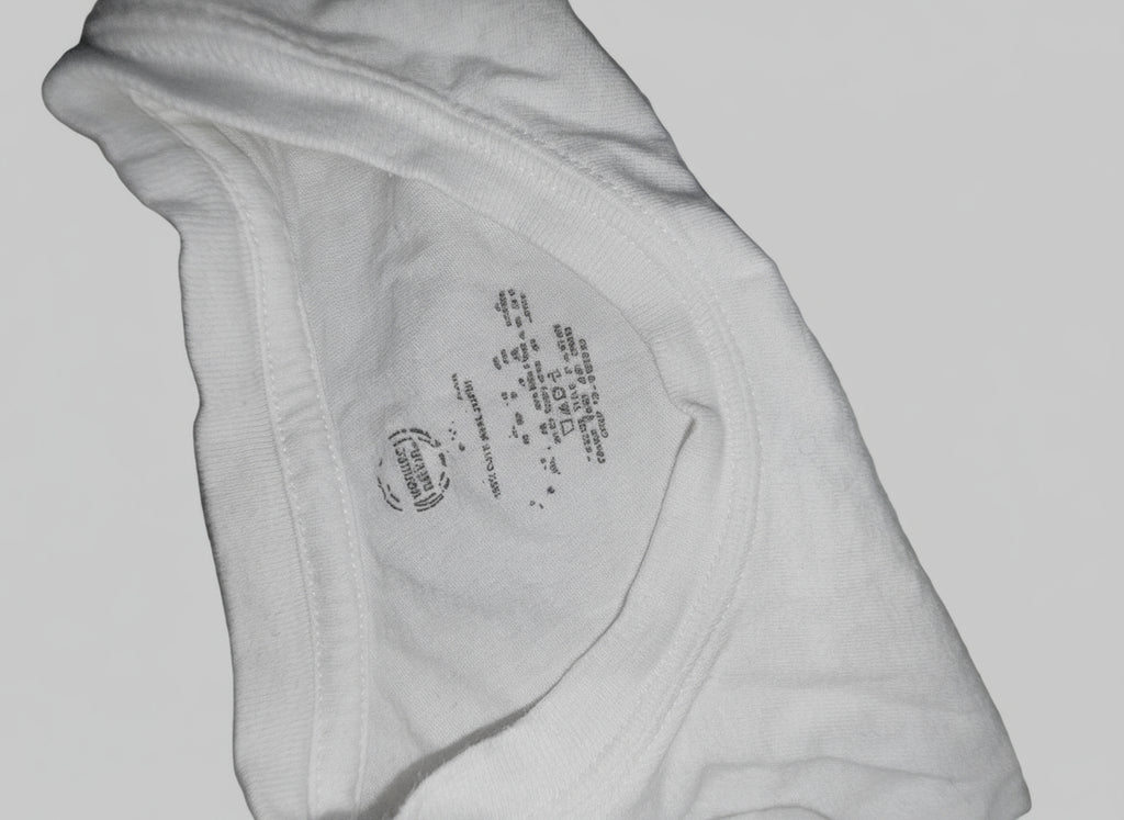 Close-up of a label on a piece of light-colored fabric.