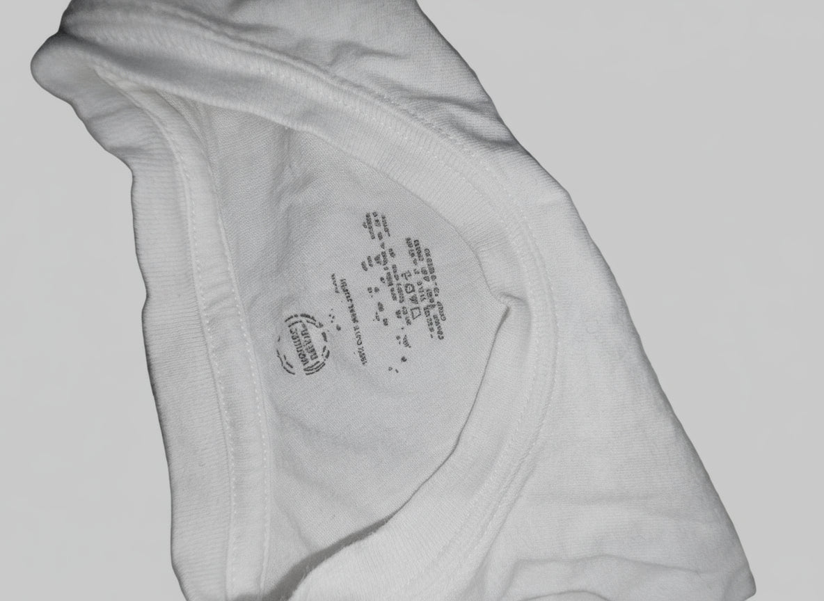 Close-up of a label on a piece of light-colored fabric.