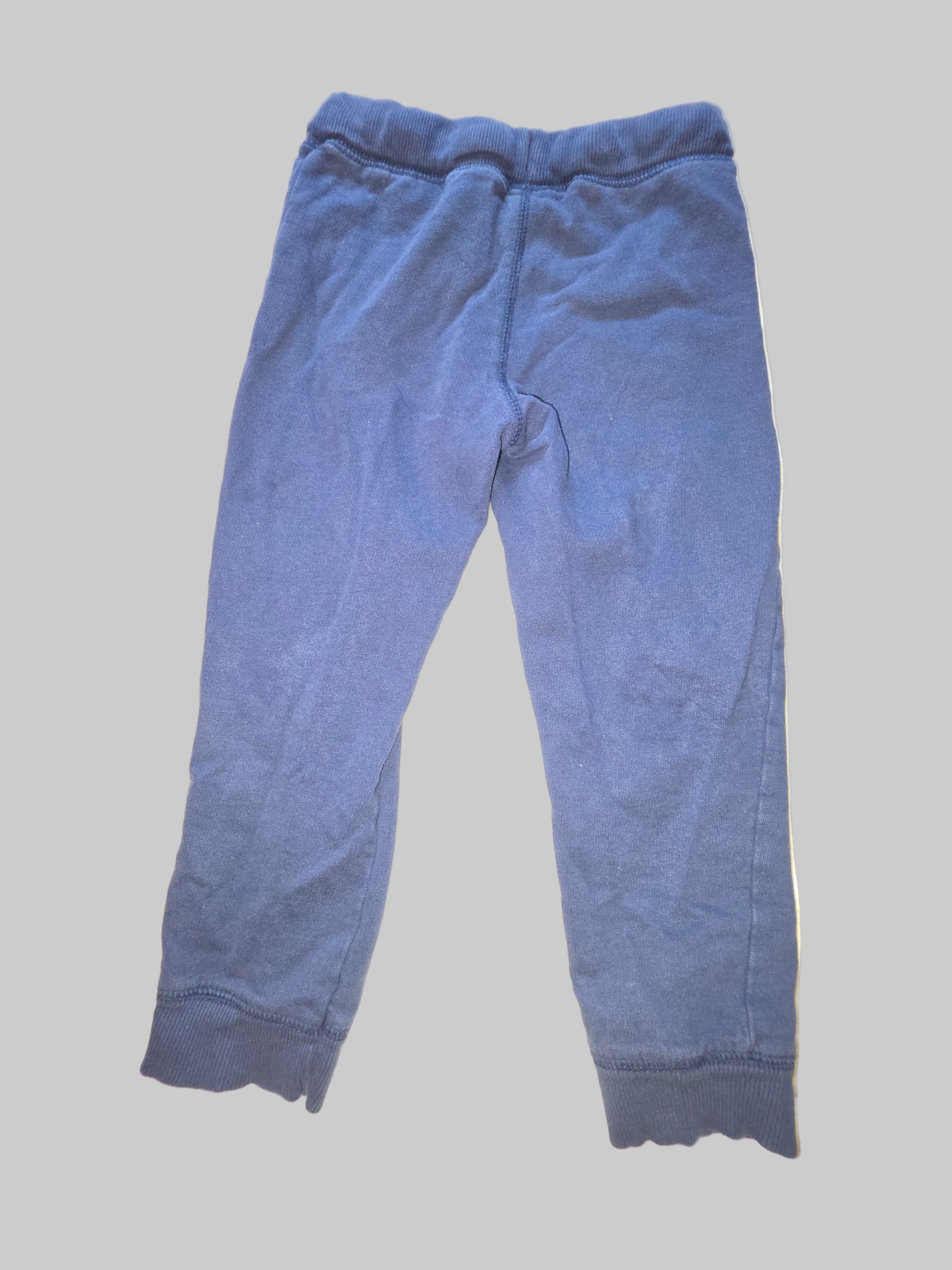 Blue pants on a white surface with a blurred background