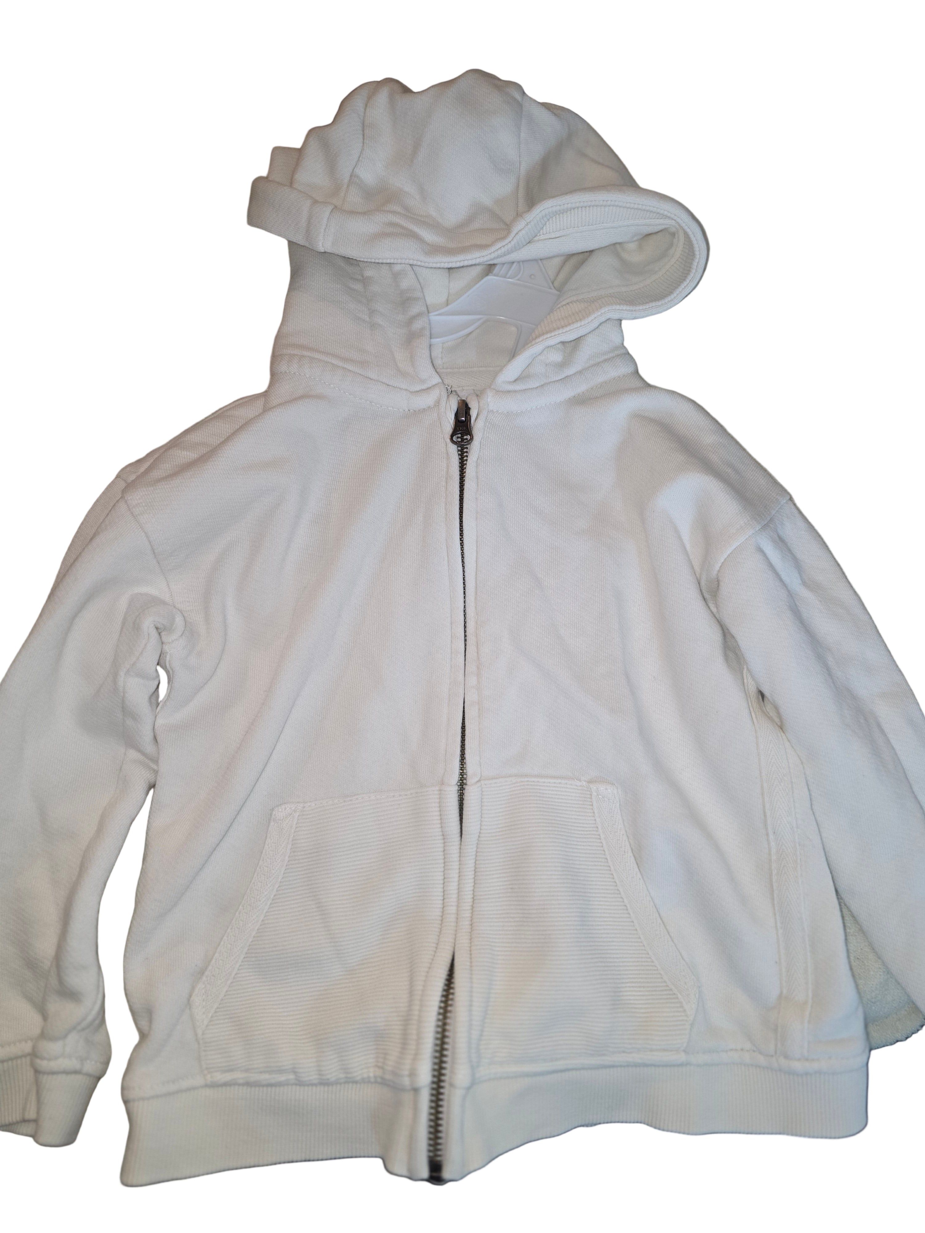 Light-colored hoodie with a zipper on a neutral background