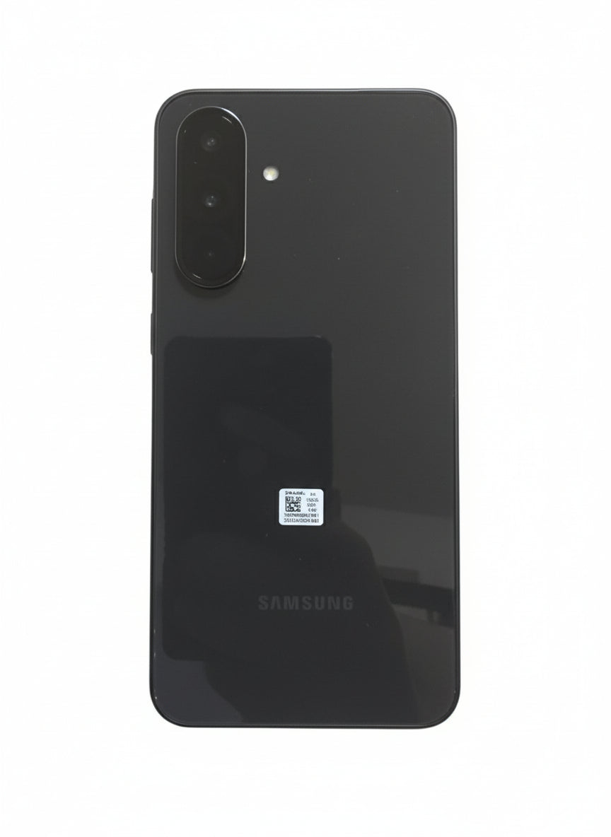 Samsung phone in a box held by a hand on a wooden surface