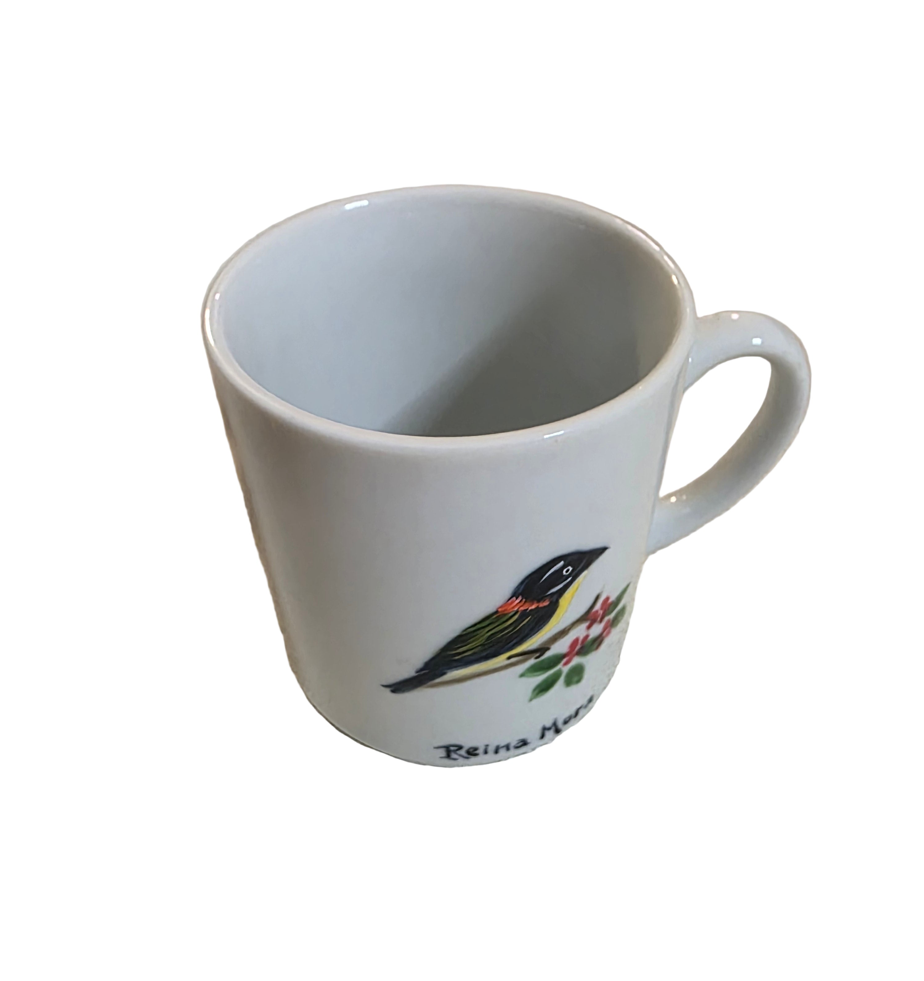 White mug with a logo on a textured surface thrift online, Acv2, TOAA shop, Toaa, TOA, toaaa shop, Silvio, jaiba, second hand, used stuff