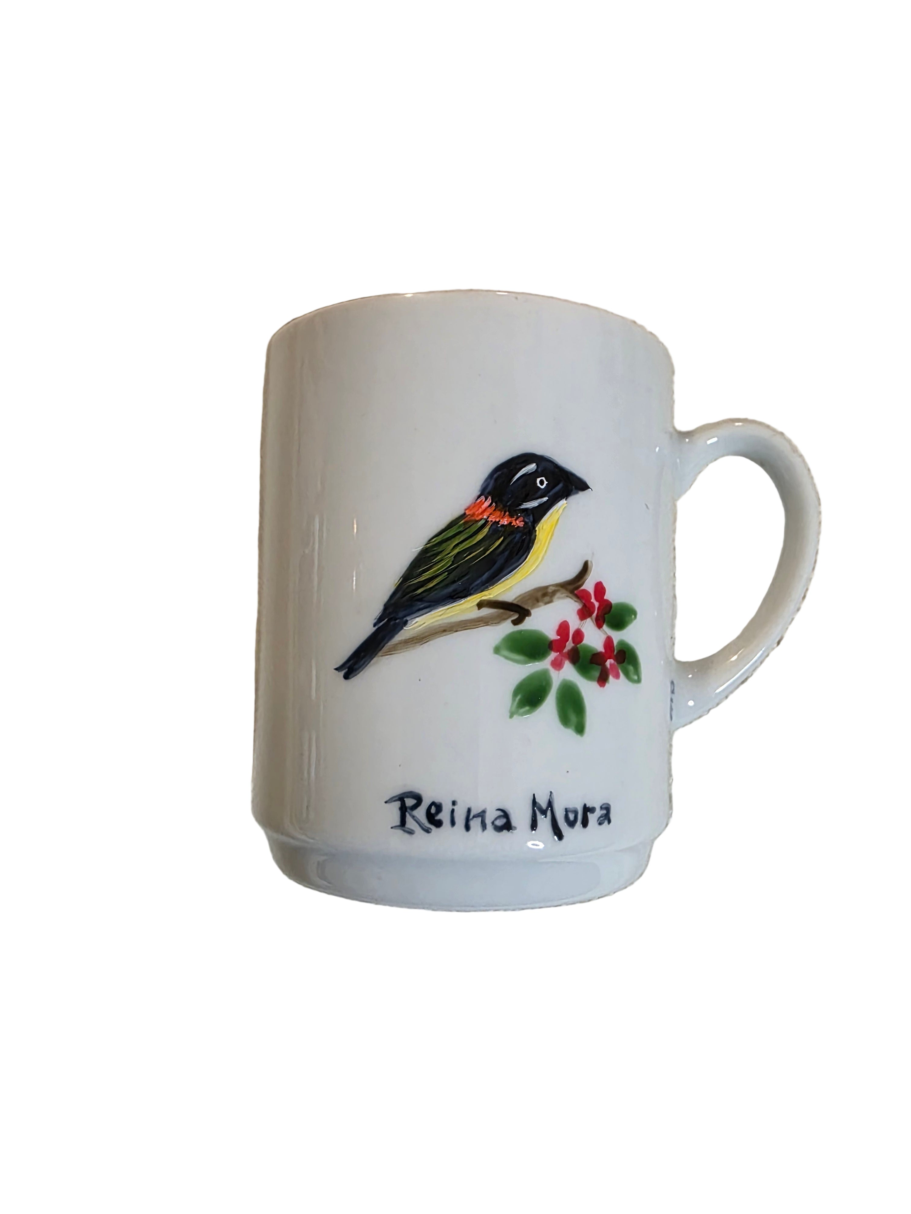 White mug with a bird and berry design on a textured beige surface thrift online, Acv2, TOAA shop, Toaa, TOA, toaaa shop, Silvio, jaiba, second hand, used stuff